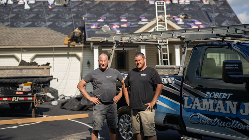 Laman Jr Construction team and commercial service truck