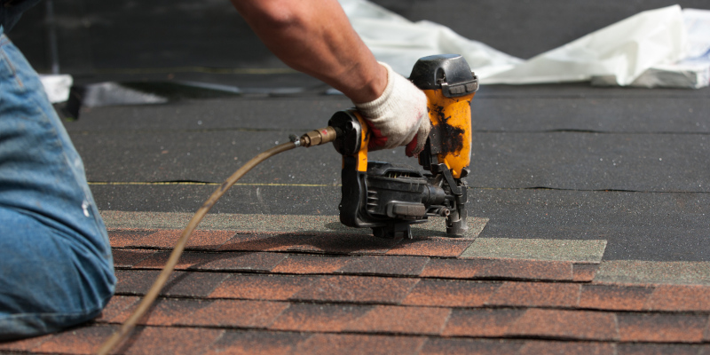 Professional roof installation with architectural shingles